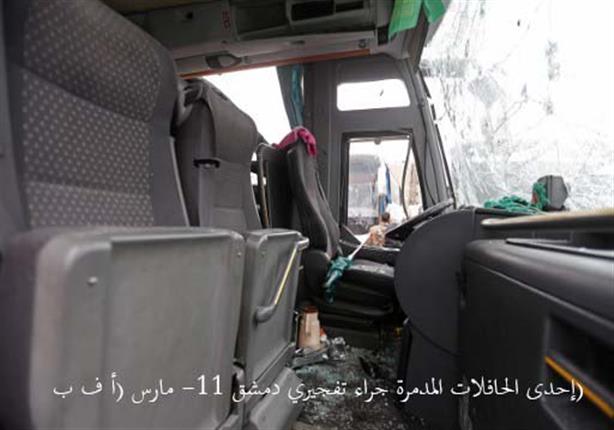 إحدى الحافلات المدمرة جراء تفجيري دمشق -11 مارس (أ ف ب)