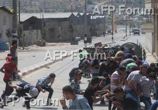 احتجاجات فلسطينية ضد الاستيطان الإسرائيلي برام الله اليوم الجمعة (أ ف ب)