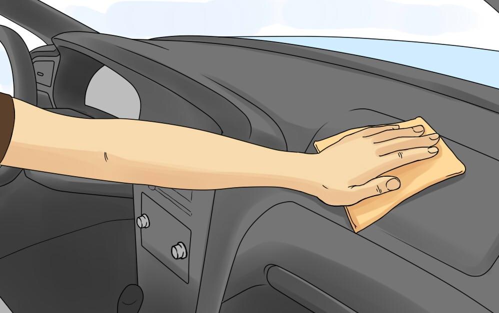 1-How to Clean Car Plastic-hand with cloth wiping dash